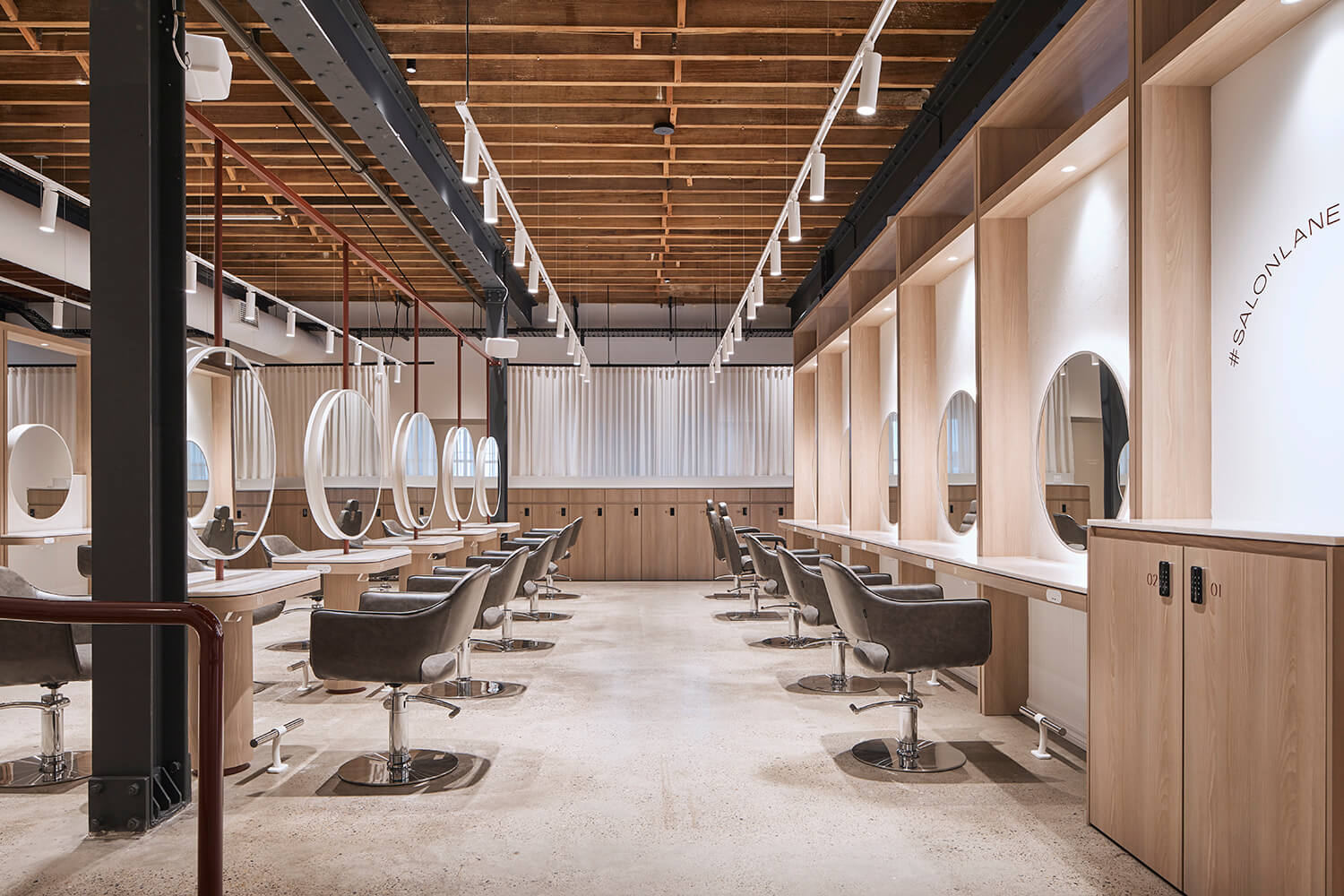 Coworking hair salon with mirrors, chairs and Salon Lane sign